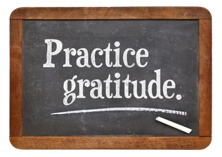 "Handwritten note with words of gratitude, emphasizing the importance of practicing gratitude."